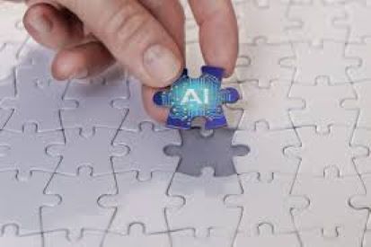 Puzzle with last piece being put in with, piece has AI written on it